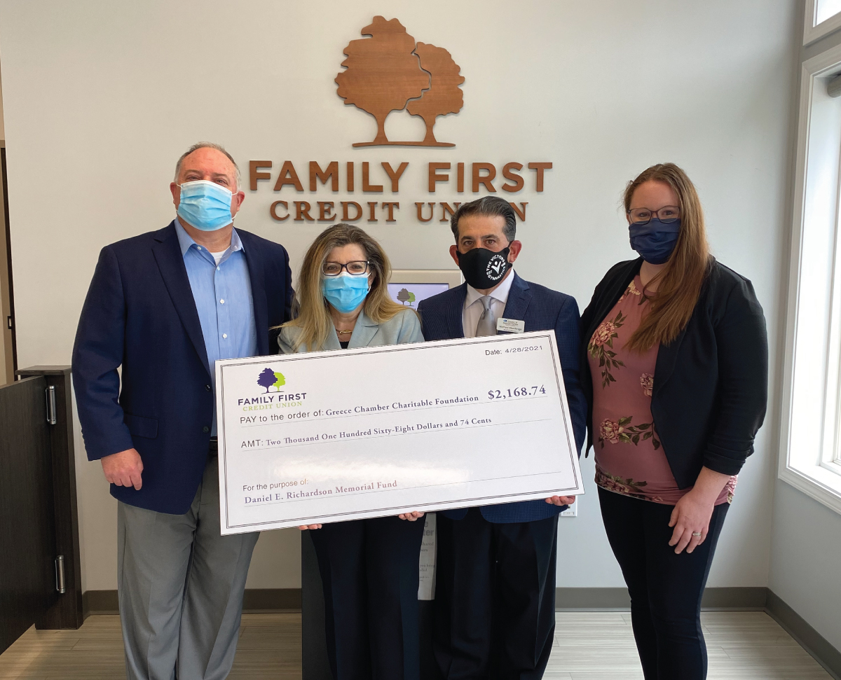 Check presentation with the Greece Chamber Charitable Foundation. From left to right: Tom Dambra (Family First CEO), Sarah Lentini (Greece Regional Chamber President & CEO), Michael Mordenga (Greece Chamber Charitable Foundation President), and Savannah Wallenhorst (Greece Branch Manager for Family First).