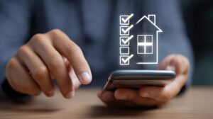 Person using a smartphone to check off home tasks